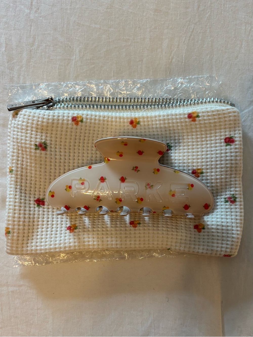 Parke White Floral Resin Hair Claw with Red Accents